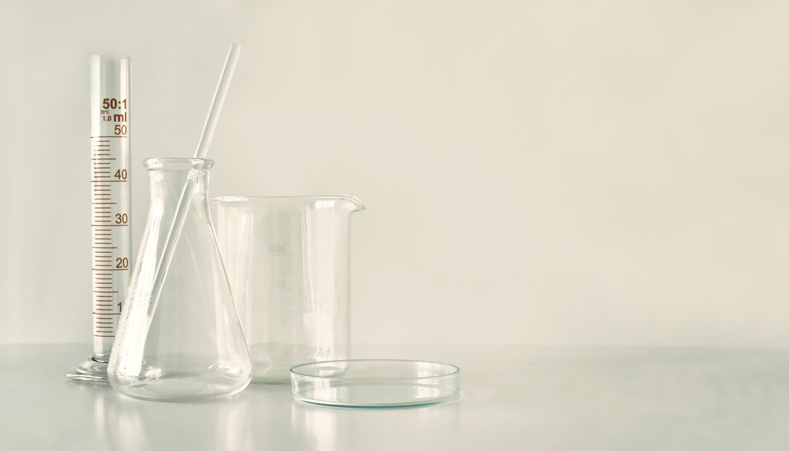 Laboratory glassware arranged on a table, symbolic of research storage and handling